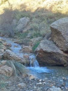 a stream of water on the side of a mountain at Chalet Vella 