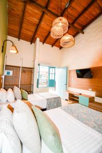 Ένα ή περισσότερα κρεβάτια σε δωμάτιο στο Hotel Salento Real Eje Cafetero