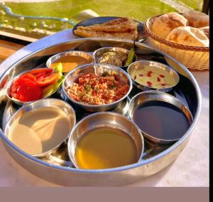 a tray filled with different types of food on a table at Erki Guest House in Abu Simbel