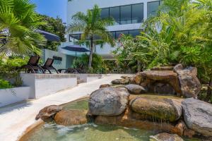 a fountain in the courtyard of a building at Tropical Retreat Pools Golf Gym Jungle Views in Akumal