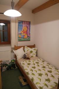 a bedroom with a bed with stuffed animals on it at Unterbrandlberg in Steinbach an der Steyr