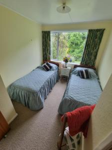 Кровать или кровати в номере Garden Paradise Siochain House