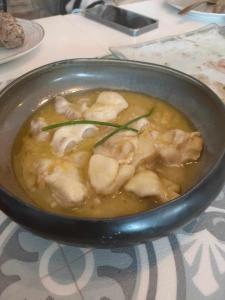 a bowl of chicken soup on a table at La Casa del Desierto in Gorafe