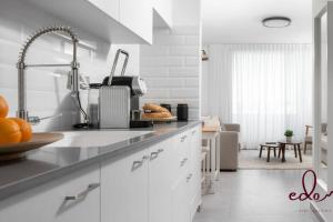 a kitchen with a sink and a counter top at דירה עם מרפסת על יד הים - By Edomlux in Eilat