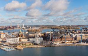 an aerial view of a city on the water at Modern apartment in a prime location in Helsinki