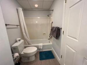 a small bathroom with a toilet and a shower at 2501 S Ocean Blvd, 1215 - Ocean View Sleeps 8 in Myrtle Beach