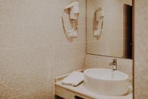 Um banheiro em Apartamentos Sol & Ria