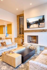 a living room with two couches and a fireplace at Luxe Sun Valley Retreat at River Run in Ketchum