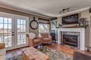a living room with a fireplace and a tv at Nashville Downtown Condo -788 in Nashville