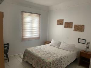 Кровать или кровати в номере Hotel Palermo Quintero
