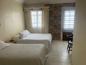 Llit o llits en una habitació de Hotel Palermo Quintero 37 fotos més