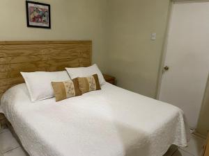 Кровать или кровати в номере Hotel Palermo Quintero