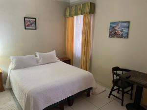 Кровать или кровати в номере Hotel Palermo Quintero