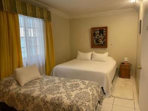 Кровать или кровати в номере Hotel Palermo Quintero