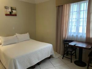 Кровать или кровати в номере Hotel Palermo Quintero