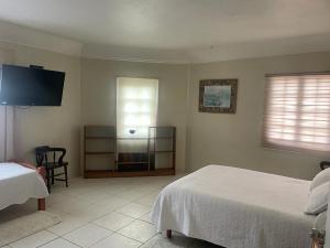 Кровать или кровати в номере Hotel Palermo Quintero