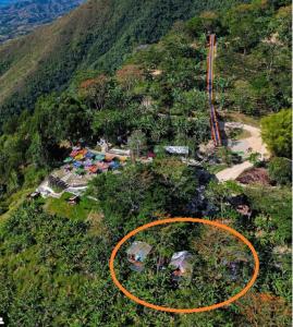 an aerial view of a mountain with an orange circle at Mano del Gigante Nomada in Gigante