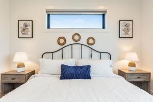 a bedroom with a white bed with two night stands at Bellevue Splendor Dune Room BY Betterstay in Bellevue