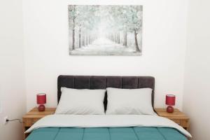Postel nebo postele na pokoji v ubytování Millennium Apartment