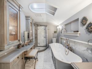 a bathroom with a tub and a sink and a shower at GLOBALSTAY. Charming 3 Bedroom House in North York in Toronto
