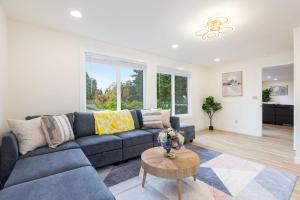 a living room with a couch and a table at Cul-de-Sac Comfort BY Betterstay in Bellevue