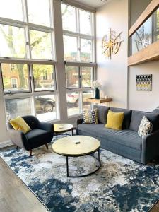 a living room with a couch and a table at Lincoln Park Light-Filled Loft in Chicago