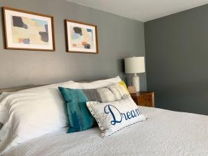 a bedroom with a bed with a pillow on it at Lincoln Park Light-Filled Loft in Chicago +10 photos