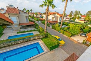an aerial view of a house with a swimming pool at Paradise Town Villa Legend in Belek