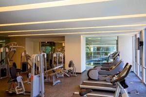 a gym with a bunch of tread machines in it at AMAZING REFORMA APARTMENT, 2 brms 2 bath, AWESOME in Mexico City