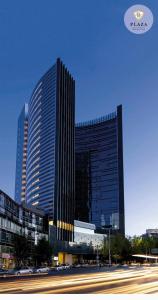 a tall building with cars parked in front of it at AMAZING REFORMA APARTMENT, 2 brms 2 bath, AWESOME in Mexico City