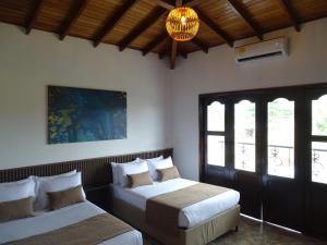 Voodi või voodid majutusasutuse Hotel Palmas De Alcalá toas +37 fotot