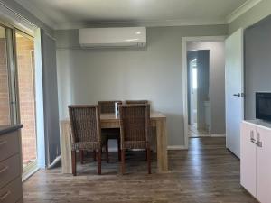 a kitchen and dining room with a table and chairs at 39onDewhurst in Mudgee +4 photos