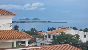 a view of the water from the roofs of buildings at Hotel Kenito in São Tomé