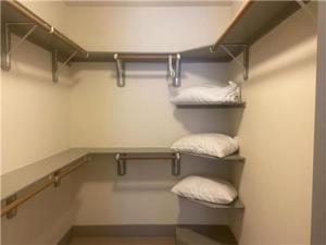 a room with three towels in a closet at Gorgeous Furnished Apartments near Texas Medical Center & NRG Stadium in Houston