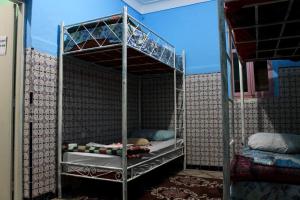 a bedroom with two bunk beds in a room at Hostel kif kif annex in Marrakech