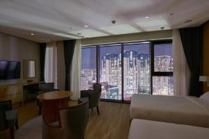 a hotel room with a view of a city at CS Hotel in Gwangju