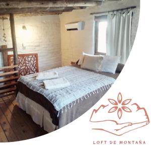 a bedroom with a large bed in a room at Vidatierra in Potrerillos