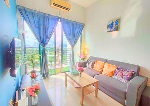 a living room with a couch and a table at Comfy Park View Stay Above DPulze Mall #DP4 in Cyberjaya