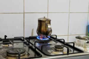 a tea kettle sitting on top of a stove at Hostel kif kif annex in Marrakech
