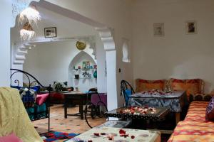 a living room with a couch and a table at Hostel kif kif annex in Marrakesh