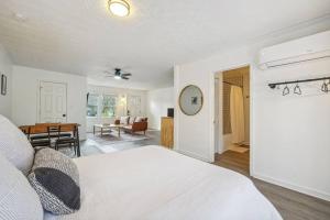 a bedroom with a bed and a living room at Cozy Kennesaw Apartment Close to KSU with EV Plug In in Kennesaw