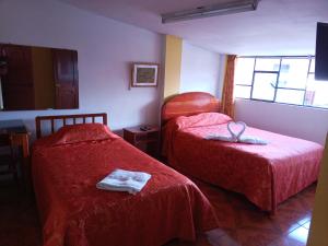 Gulta vai gultas numurā naktsmītnē Hostal Cusco Inn
