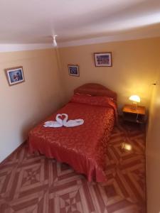 Gulta vai gultas numurā naktsmītnē Hostal Cusco Inn