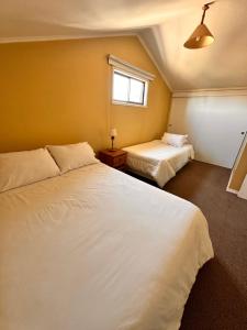 Cama o camas de una habitación en Apart hotel Terra Valdivia