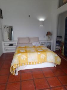 En eller flere senge i et værelse på Casa Grega em Angra dos Reis com Piscina e Vista Espetacular