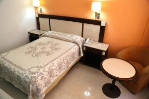 Postel nebo postele na pokoji v ubytování Hotel Baluarte
