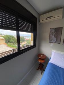 Cama o camas de una habitación en Apartamento em Florianópolis