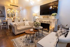 a living room with a fireplace and a tv at Casa Ramos Salamanca - Airport pick up and drop off service - Homestay in Lima