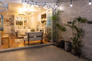 a living room with a couch and a table at Casa Ramos Salamanca - Airport pick up and drop off service - Homestay in Lima
