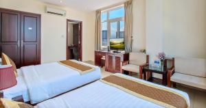 Ένα ή περισσότερα κρεβάτια σε δωμάτιο στο Sunview Beach Hotel Danang